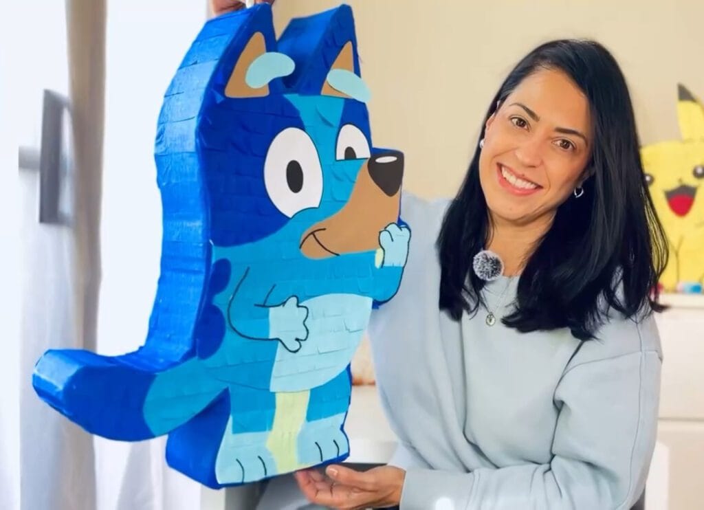 bluey pinata being shown by the creator